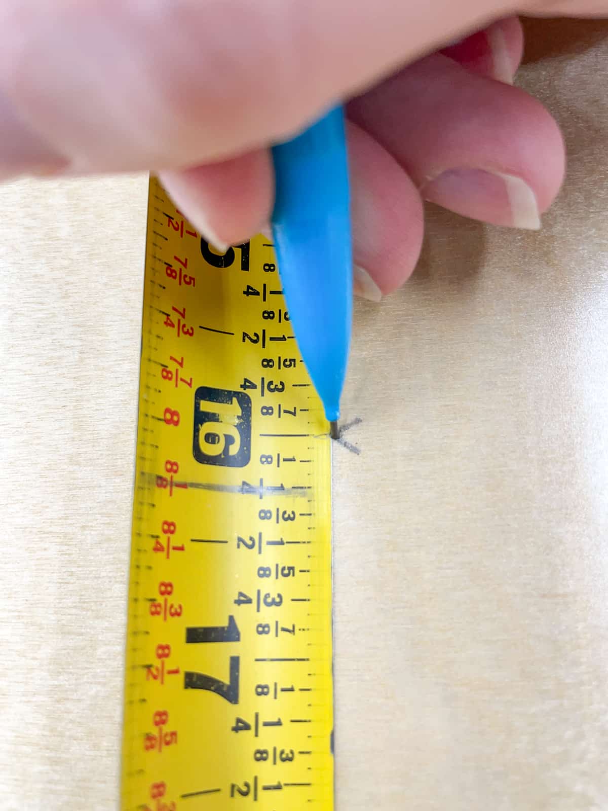 marking 16" on a tape measure with a V