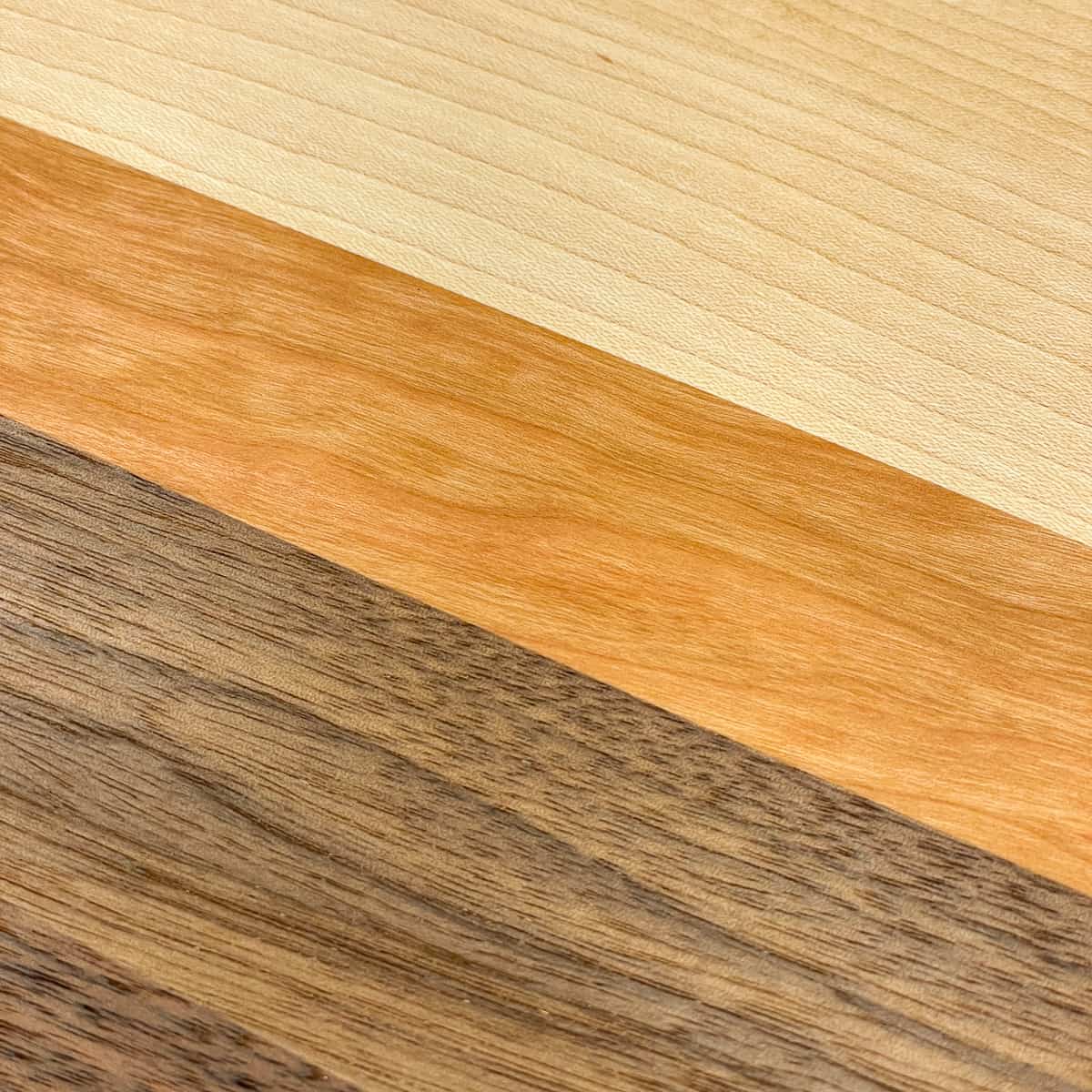 tight joints between maple, cherry and walnut wood strips in cutting board