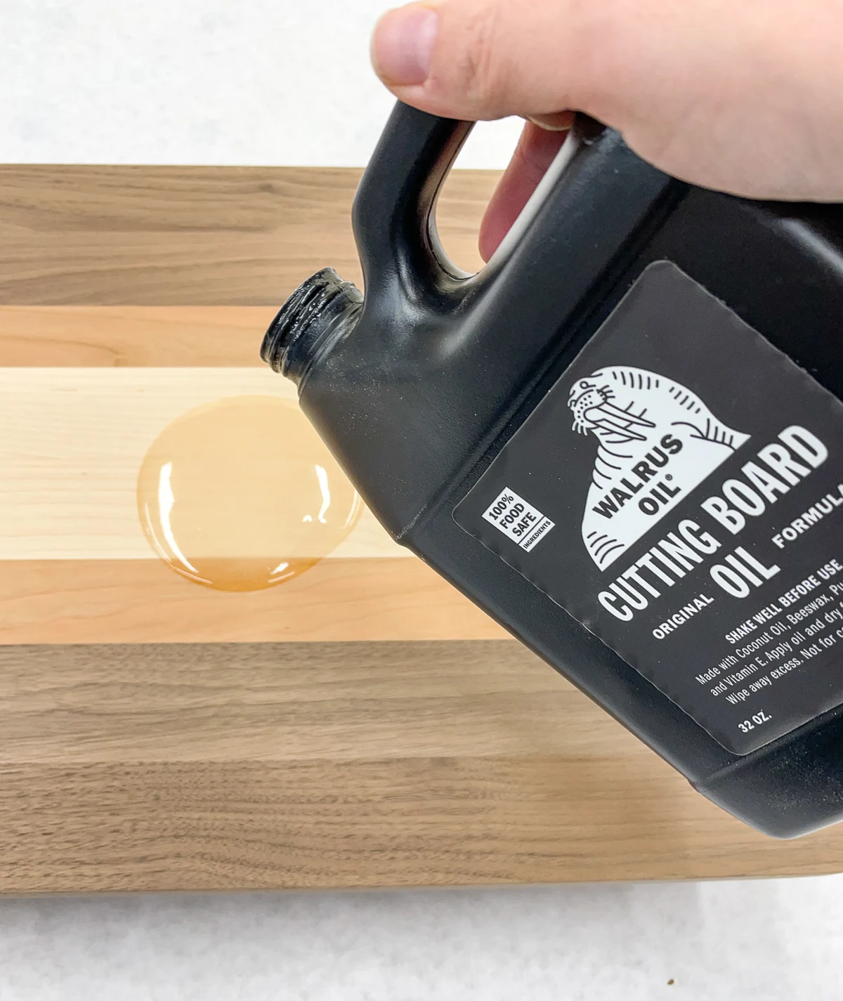 pouring cutting board oil onto cutting board