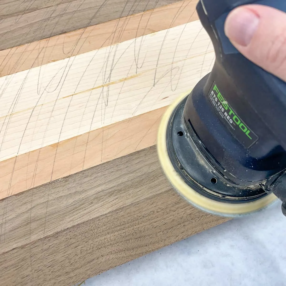 sanding off pencil marks on cutting board surface