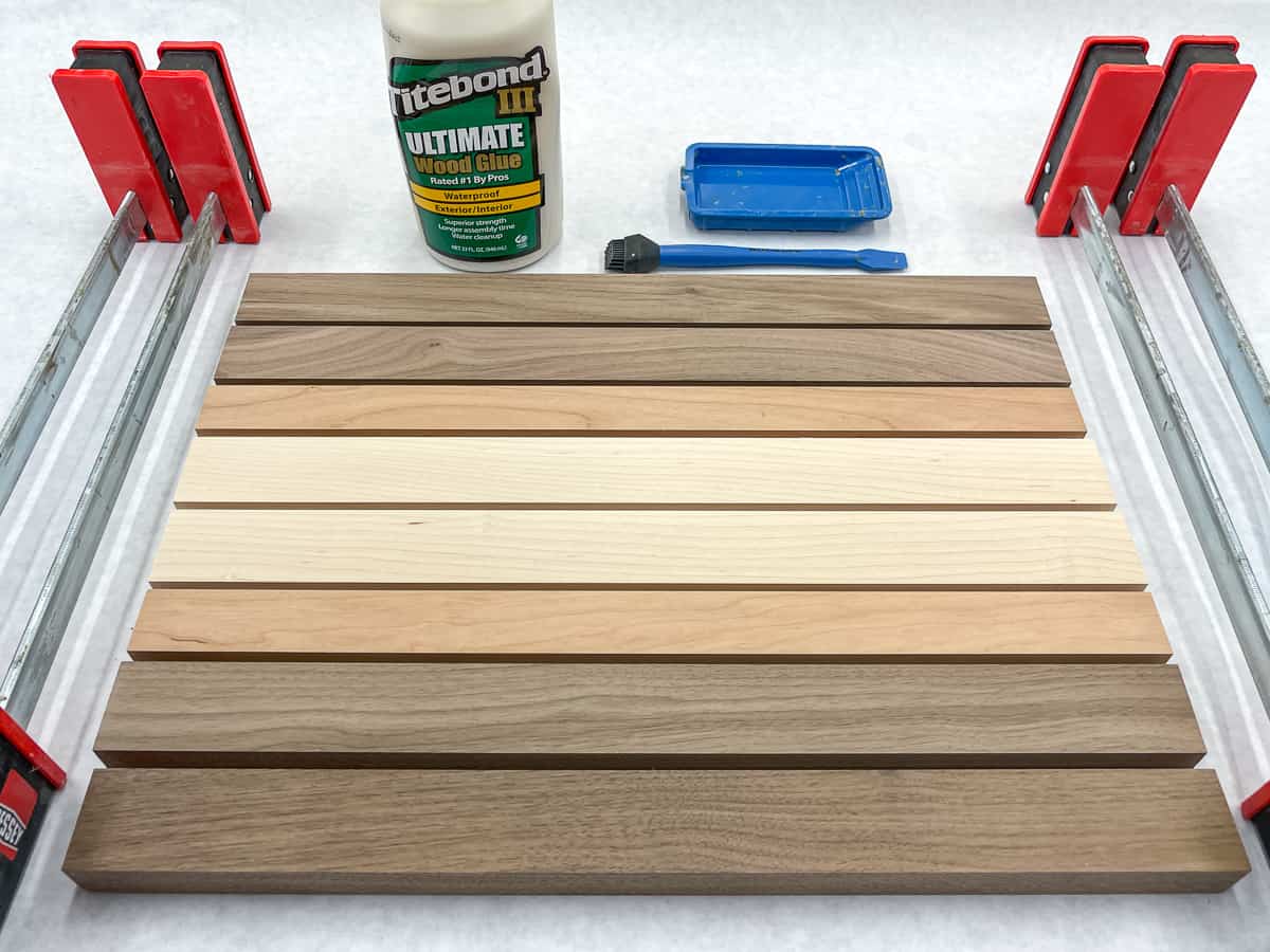 cutting board kit supplies, including clamps and wood glue