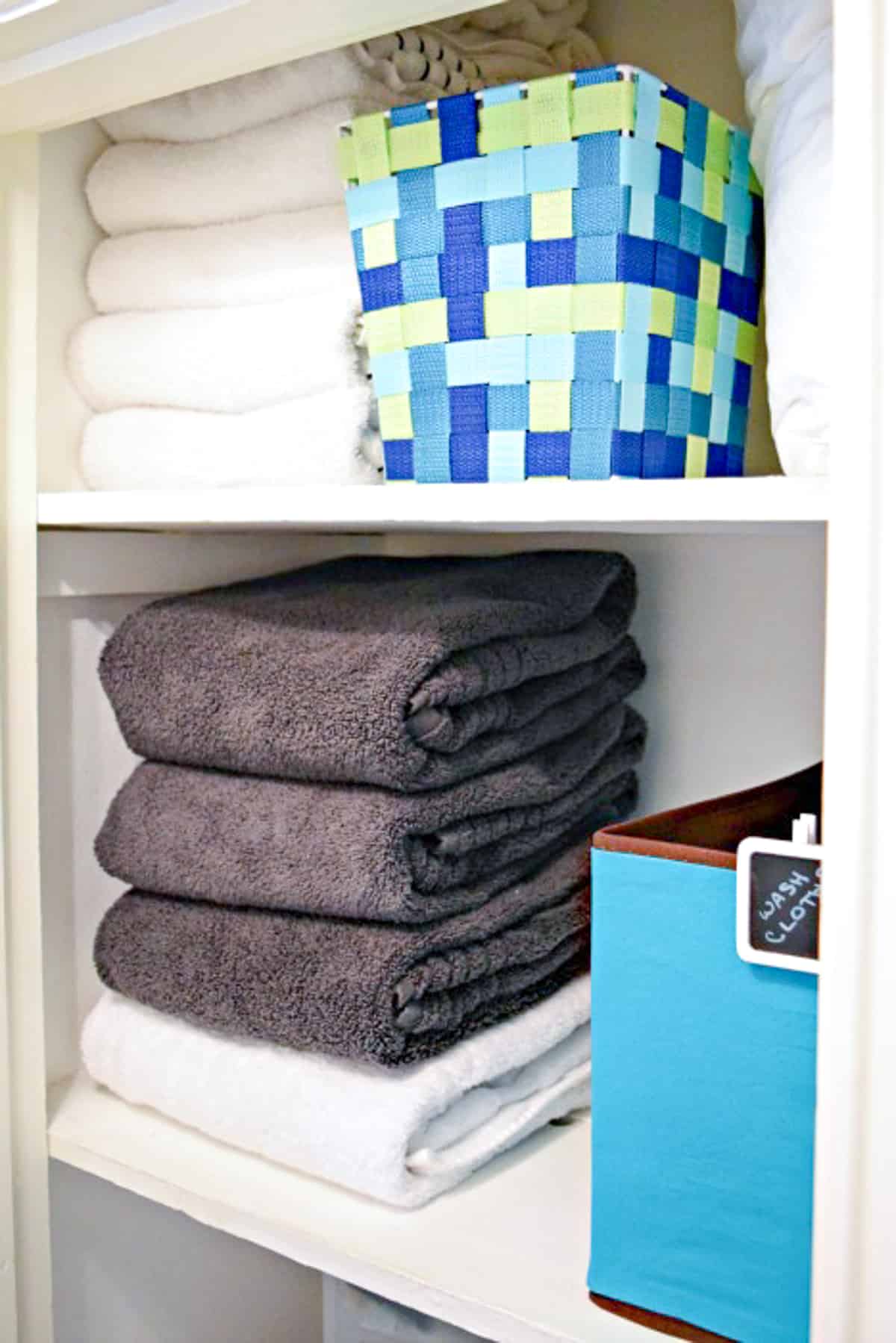 linen closet shelves organized with products from Daiso
