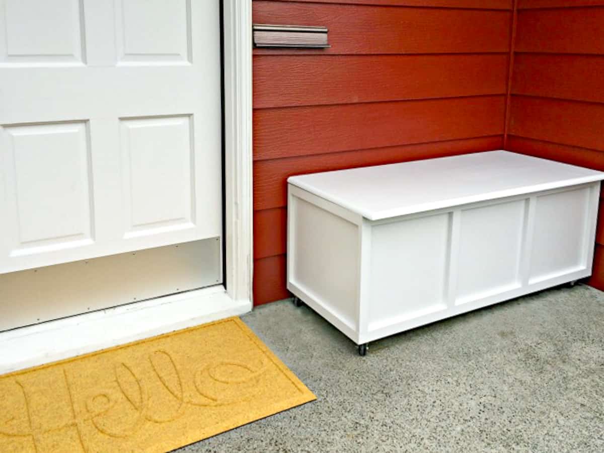 DIY outdoor storage bench on front porch