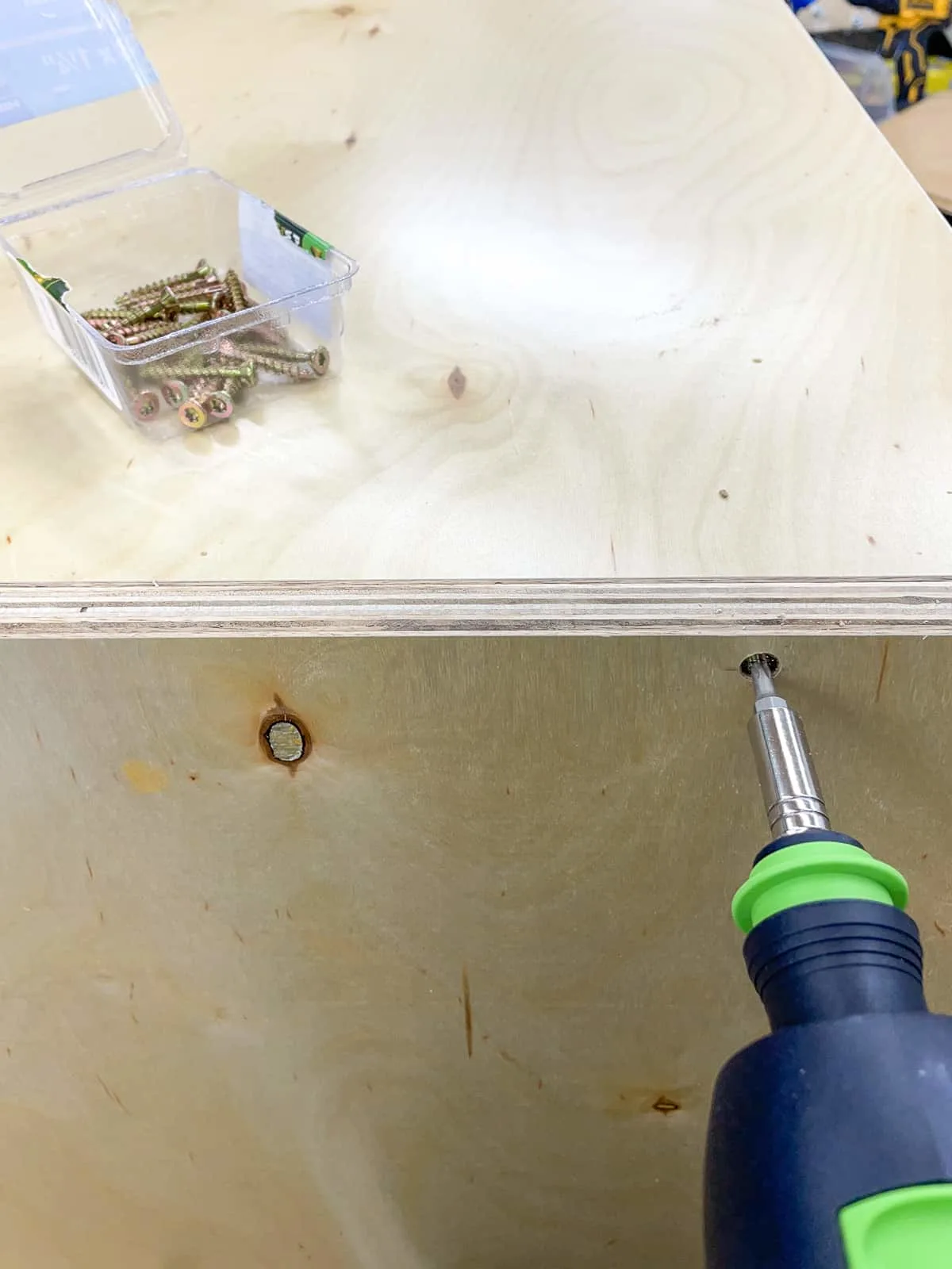 assembling the over the fridge cabinet box