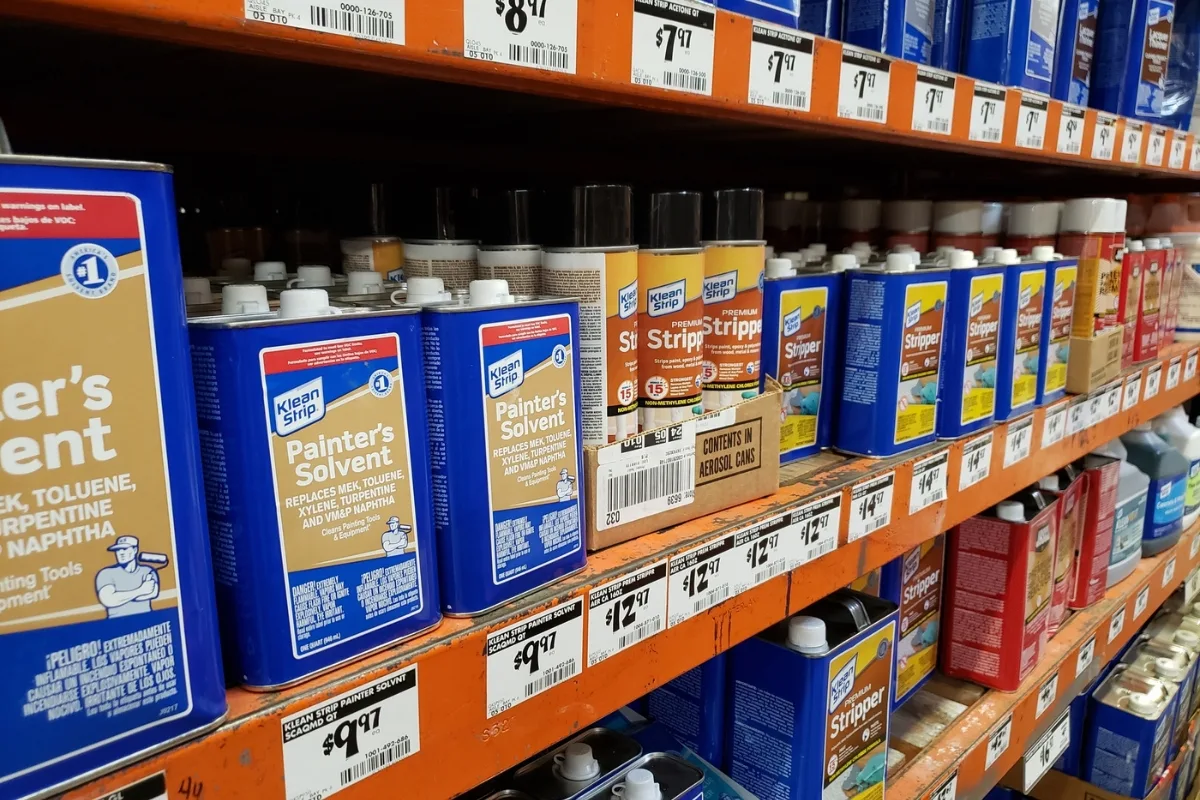 Home Depot aisle with paint thinners and mineral spirits on the shelves