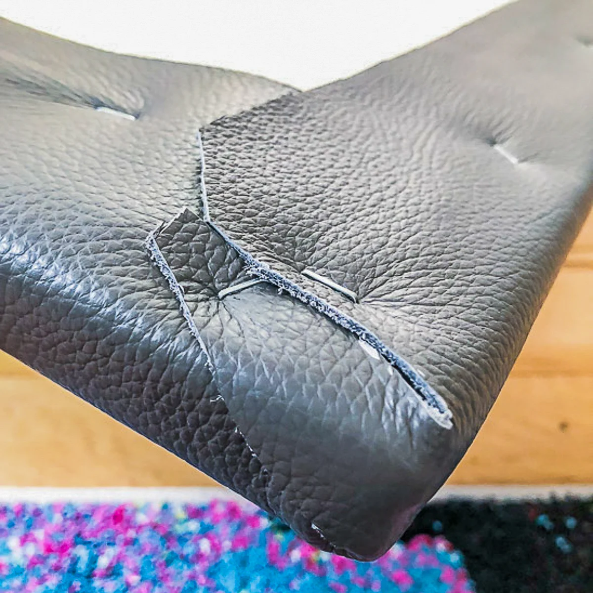 leather wrapped around corner of DIY bench cushion