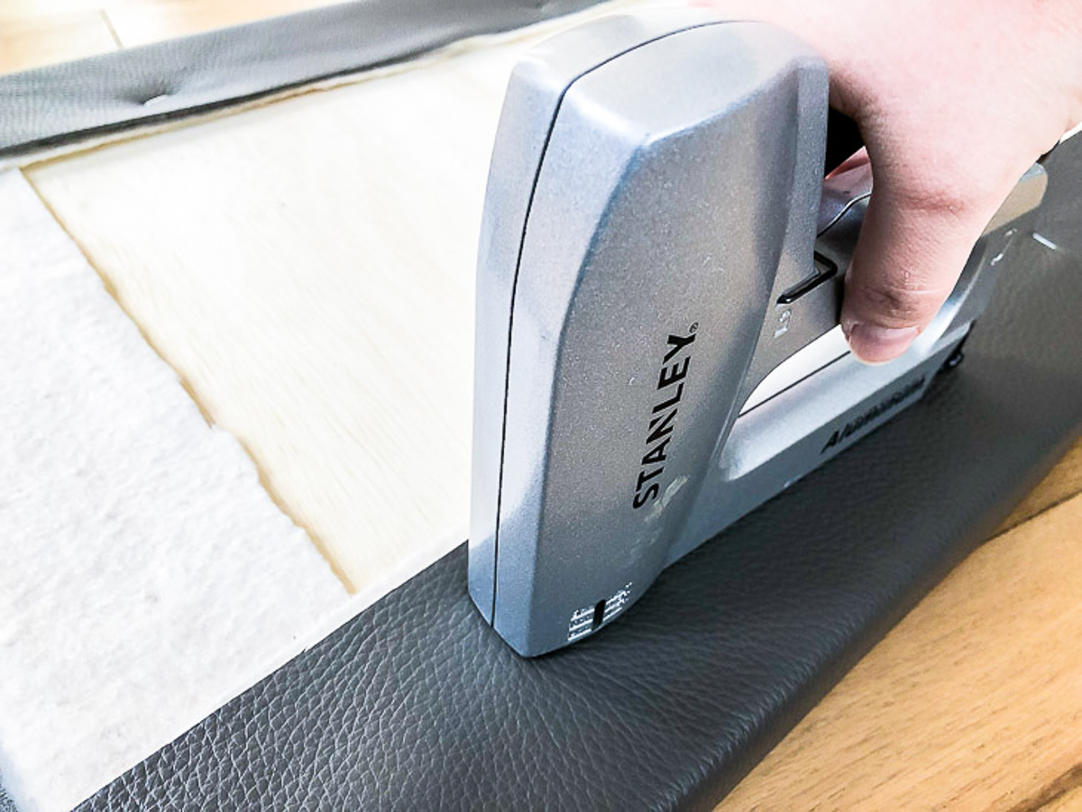 stapling DIY bench cushion fabric to plywood bottom