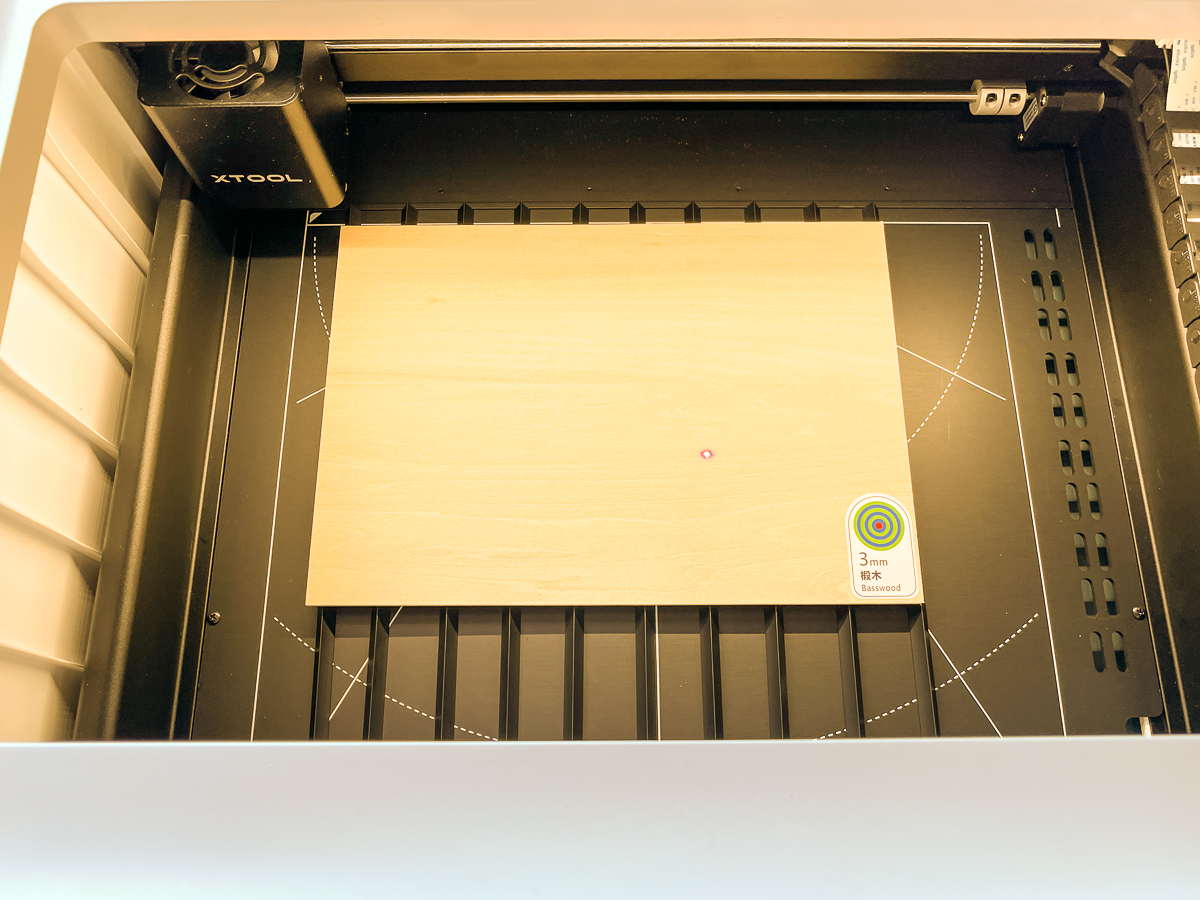 basswood plywood inside the xTool M1 machine on metal pyramids