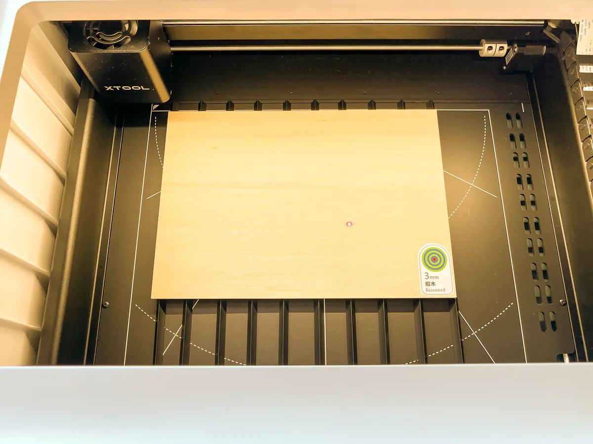 basswood plywood inside the xTool M1 machine on metal pyramids