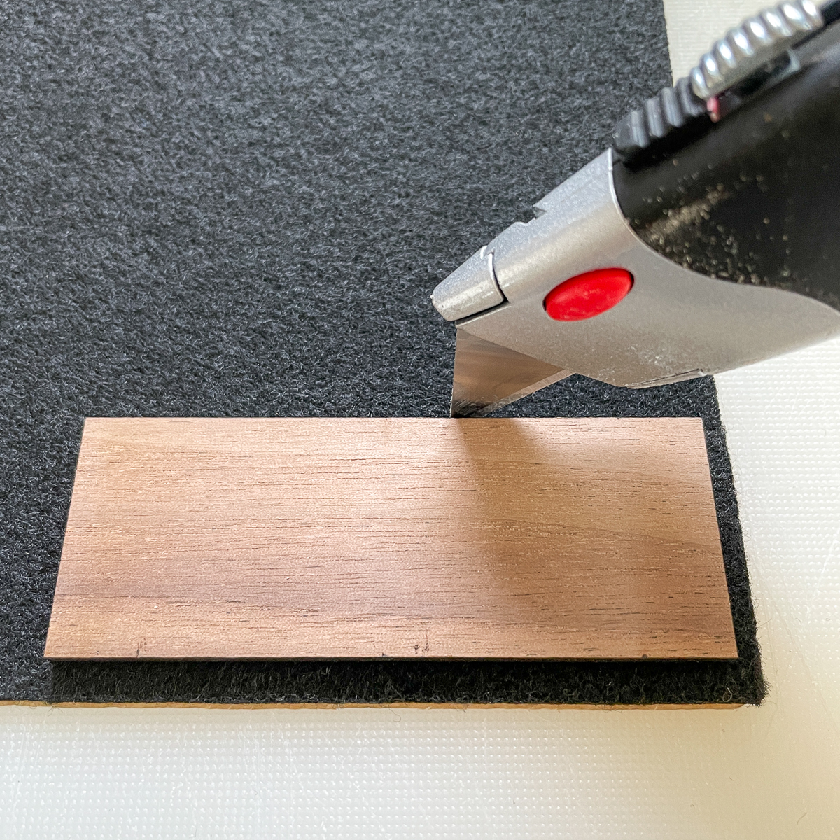 cutting out felt for DIY dice box lid with a utility knife