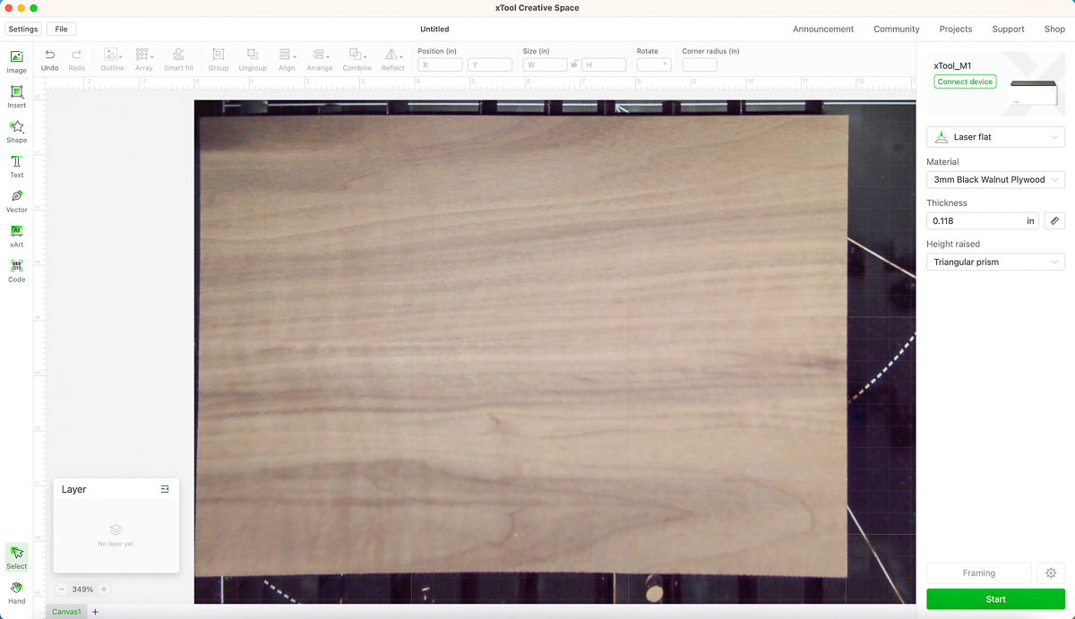 screenshot of xTool Creative Space software with image of black walnut plywood in the machine