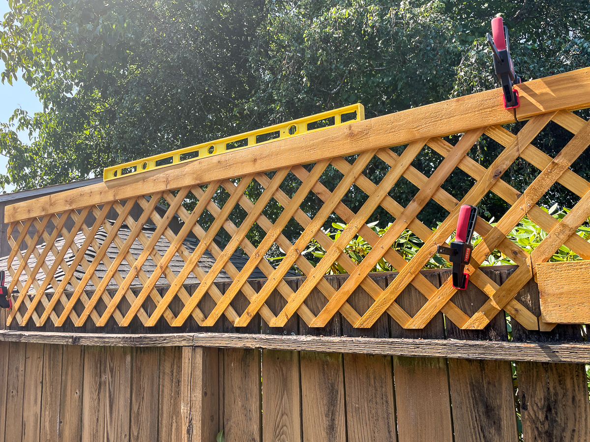 attaching the second panel of the fence top trellis