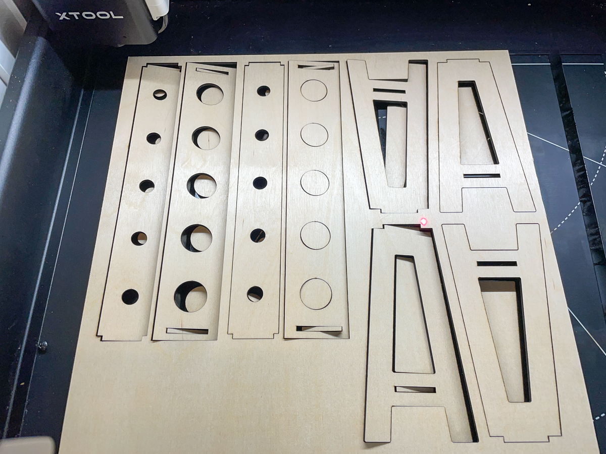 pieces for propagation station cut out of plywood in a laser cutter