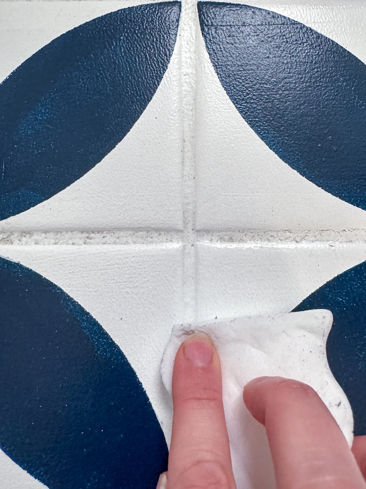 cleaning painted grout lines with a magic eraser