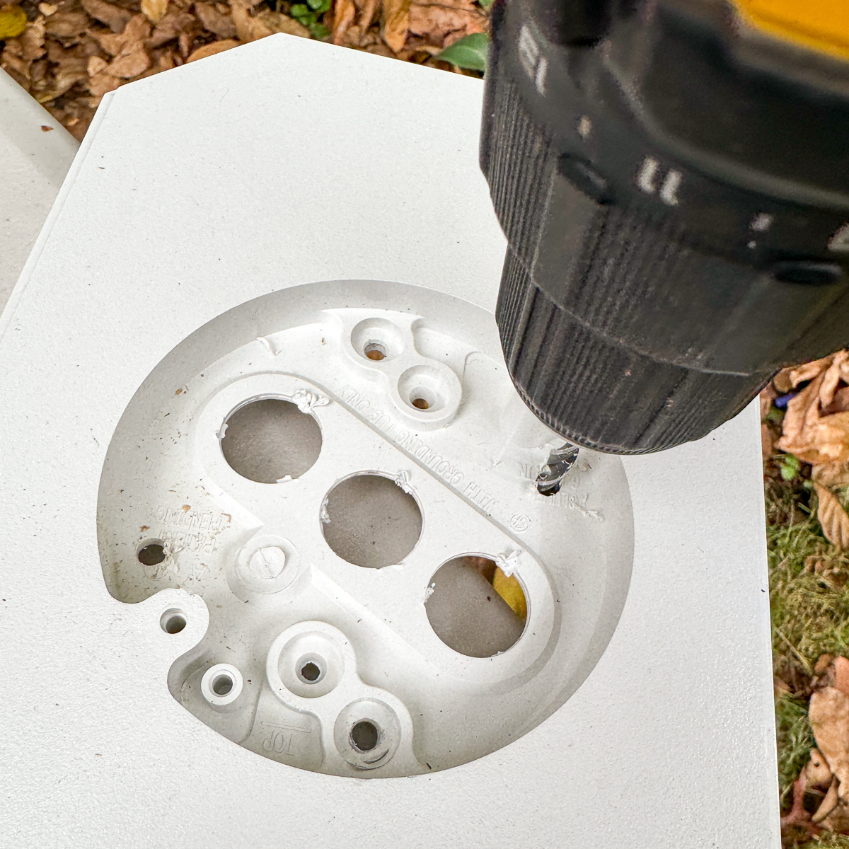 drilling holes in the mounting block