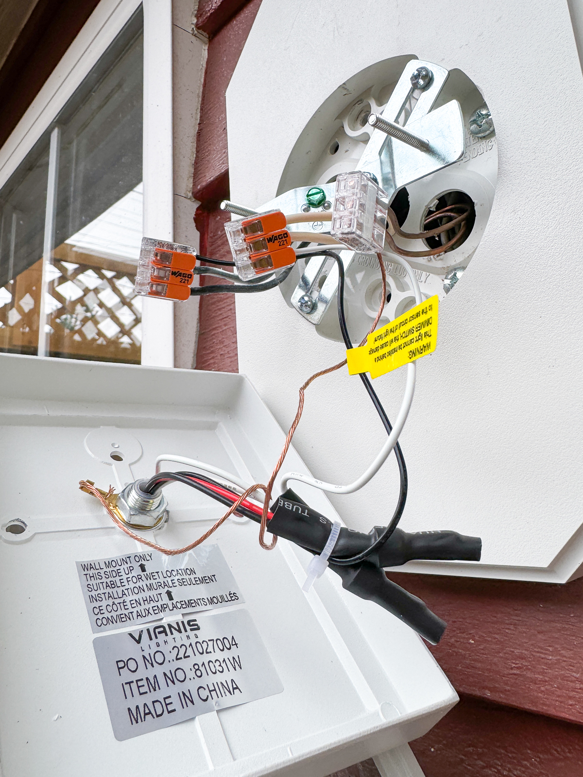 outdoor light fixture attached to the wall wires with lever nuts