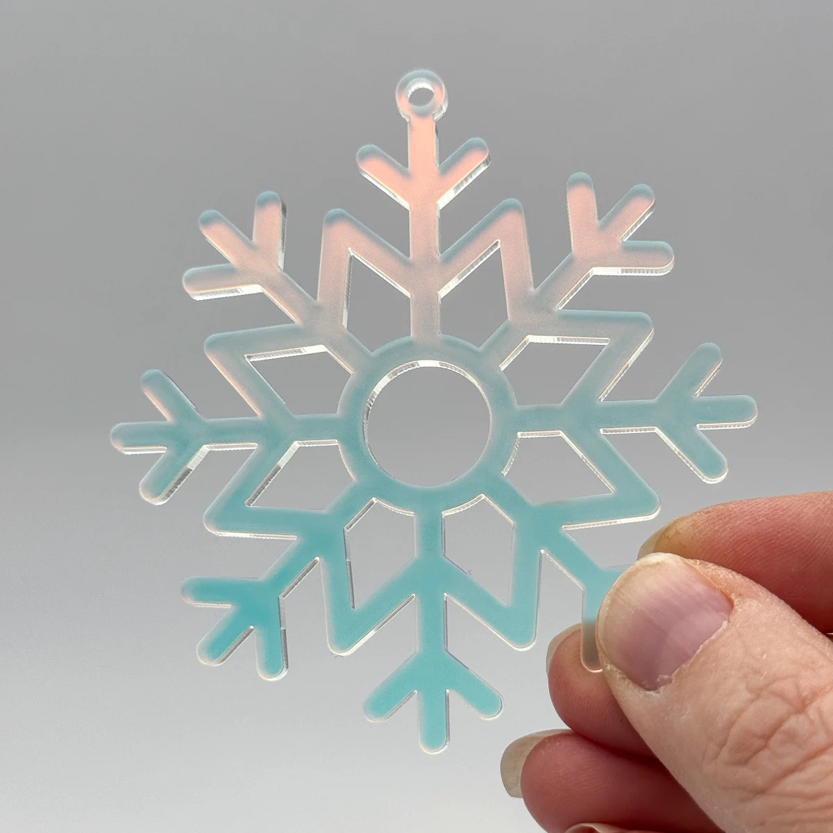 iridescent acrylic ornament cut with the xTool P2 CO2 laser cutter