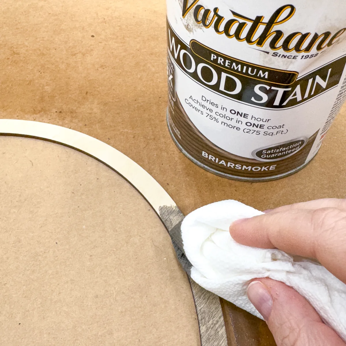 applying stain to outer frame of DIY coin holder display