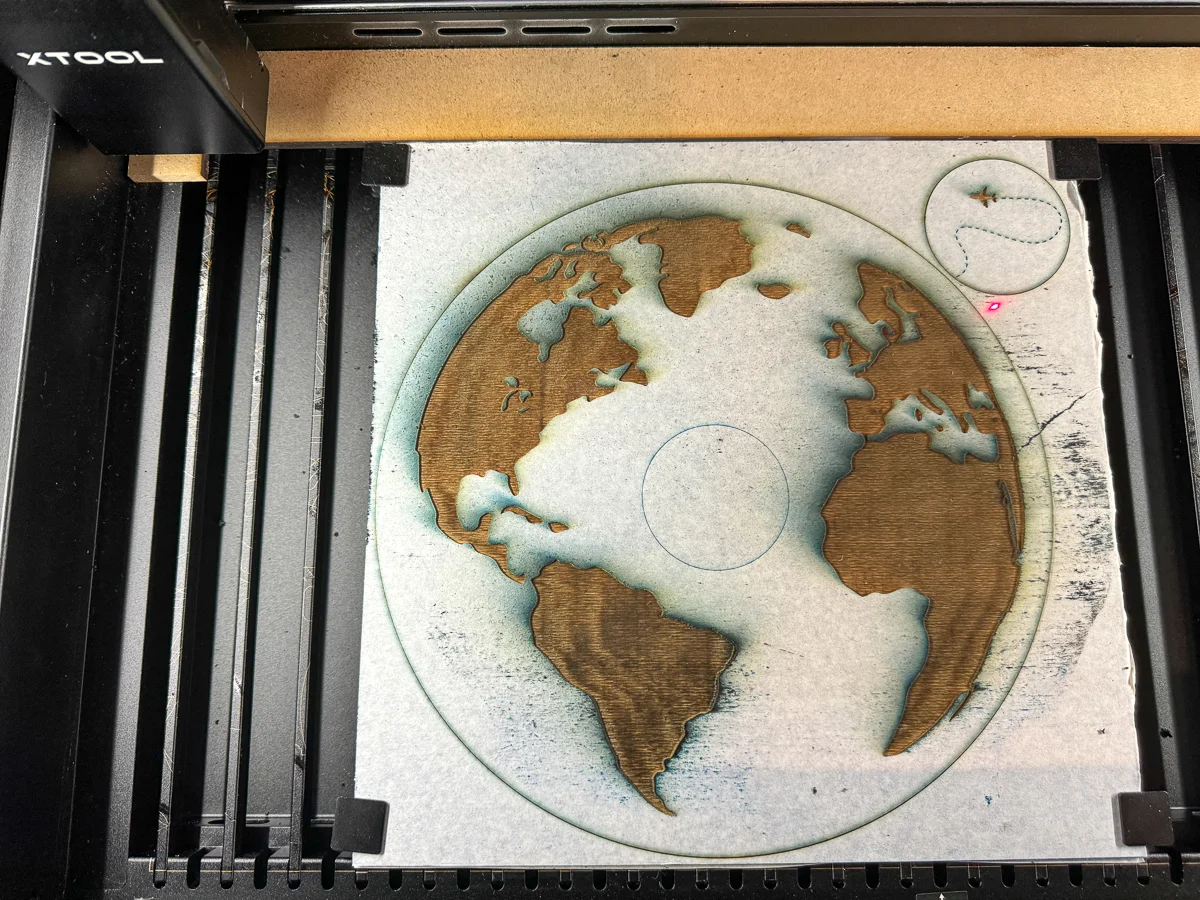 engraving a world map for the DIY coin holder with the xTool P2