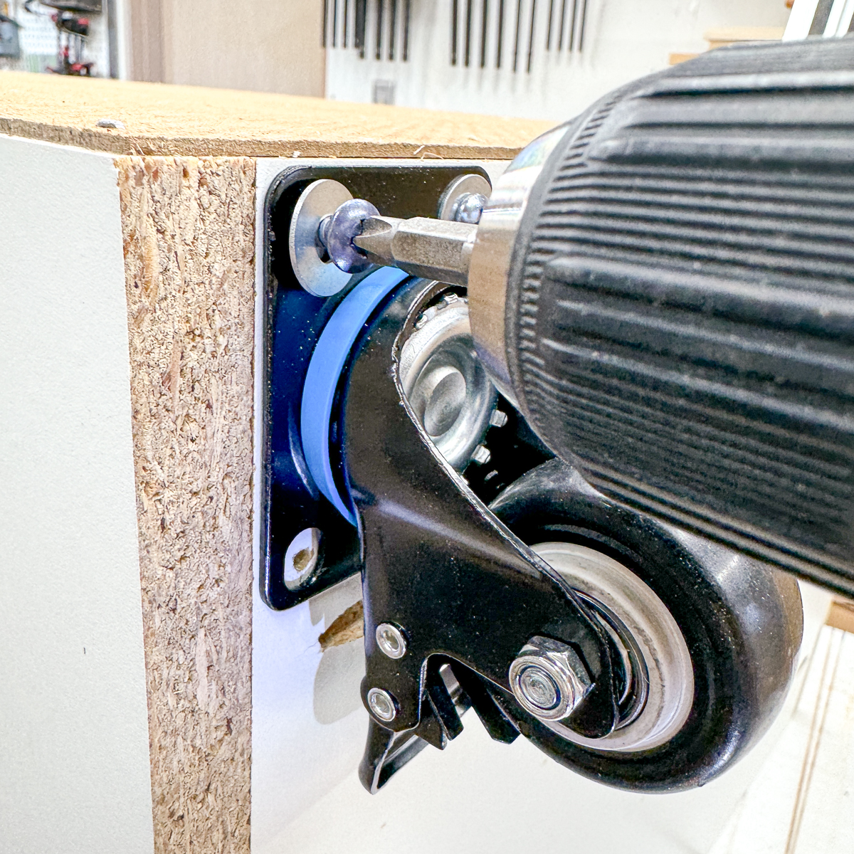 installing casters on the bottom of the craft cabinet