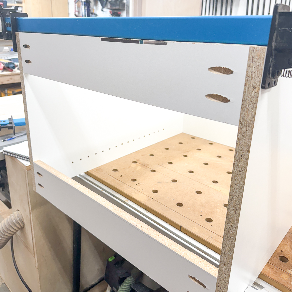 attaching stretchers across the top of the craft cabinet box