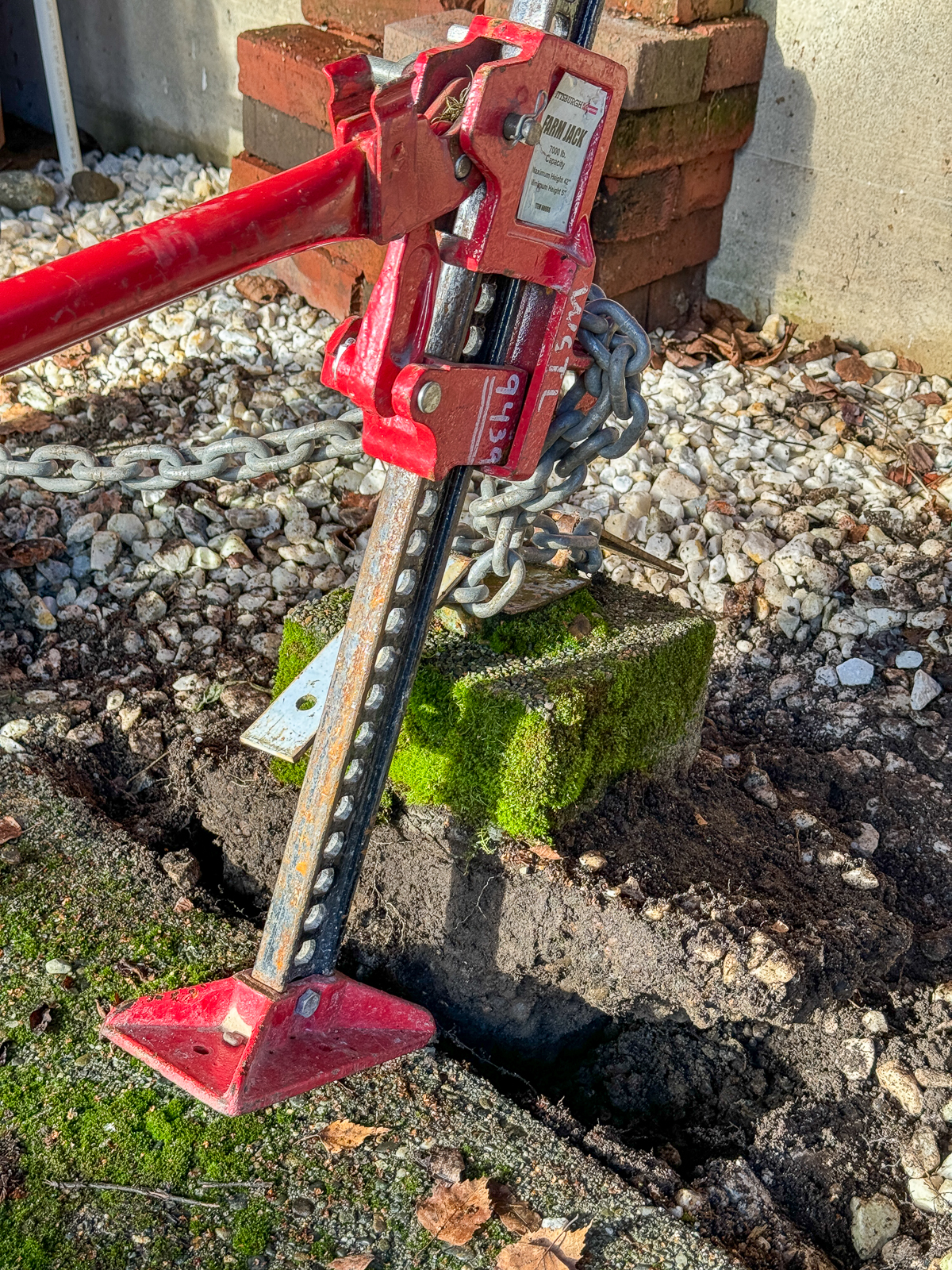 jack tipping forward under the weight of the concrete