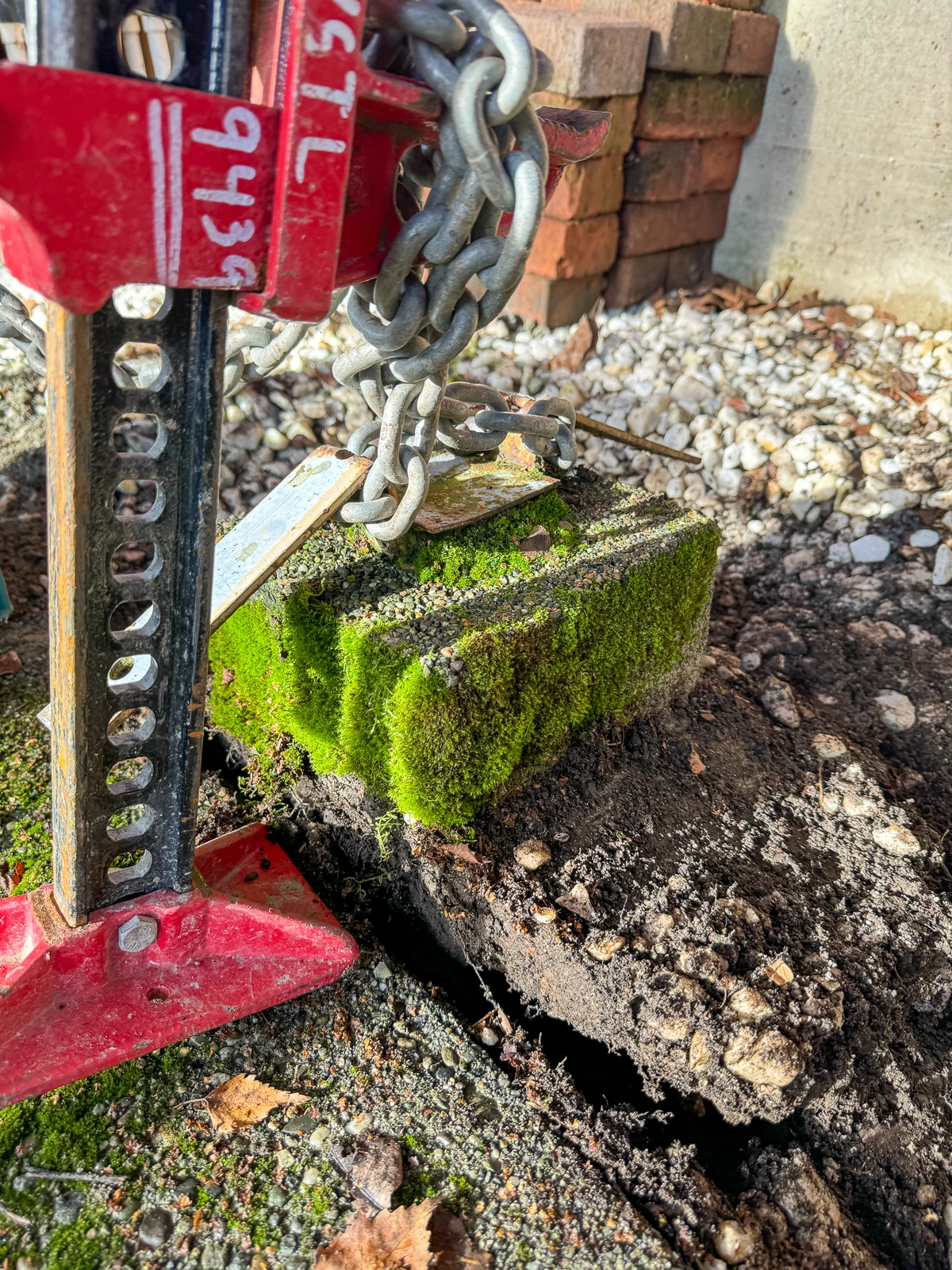 concrete post raised with a farm jack