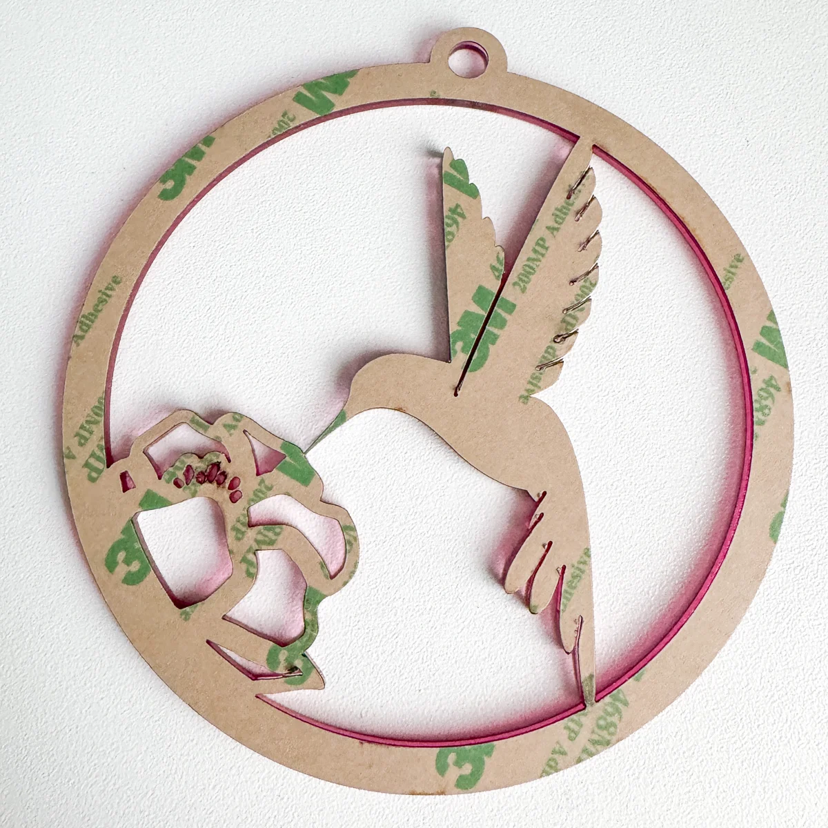 adhesive backing on pink hummingbird suncatcher