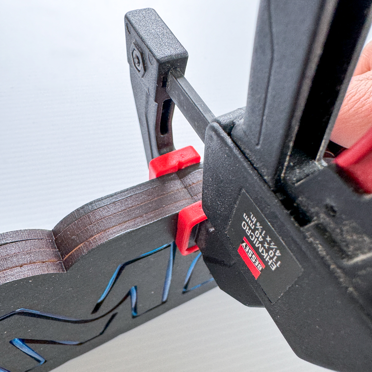 Bessey mini clamps holding the glued up layers of the neon sign in place