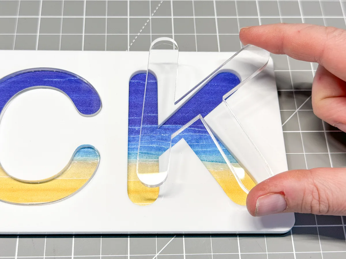 inserting the letter K into the name puzzle