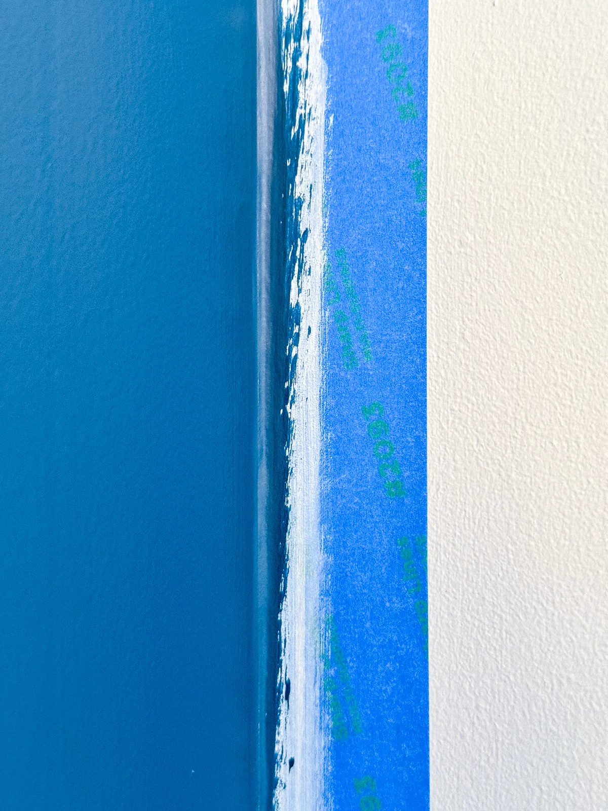painting over sealed painter's tape with new color on accent wall