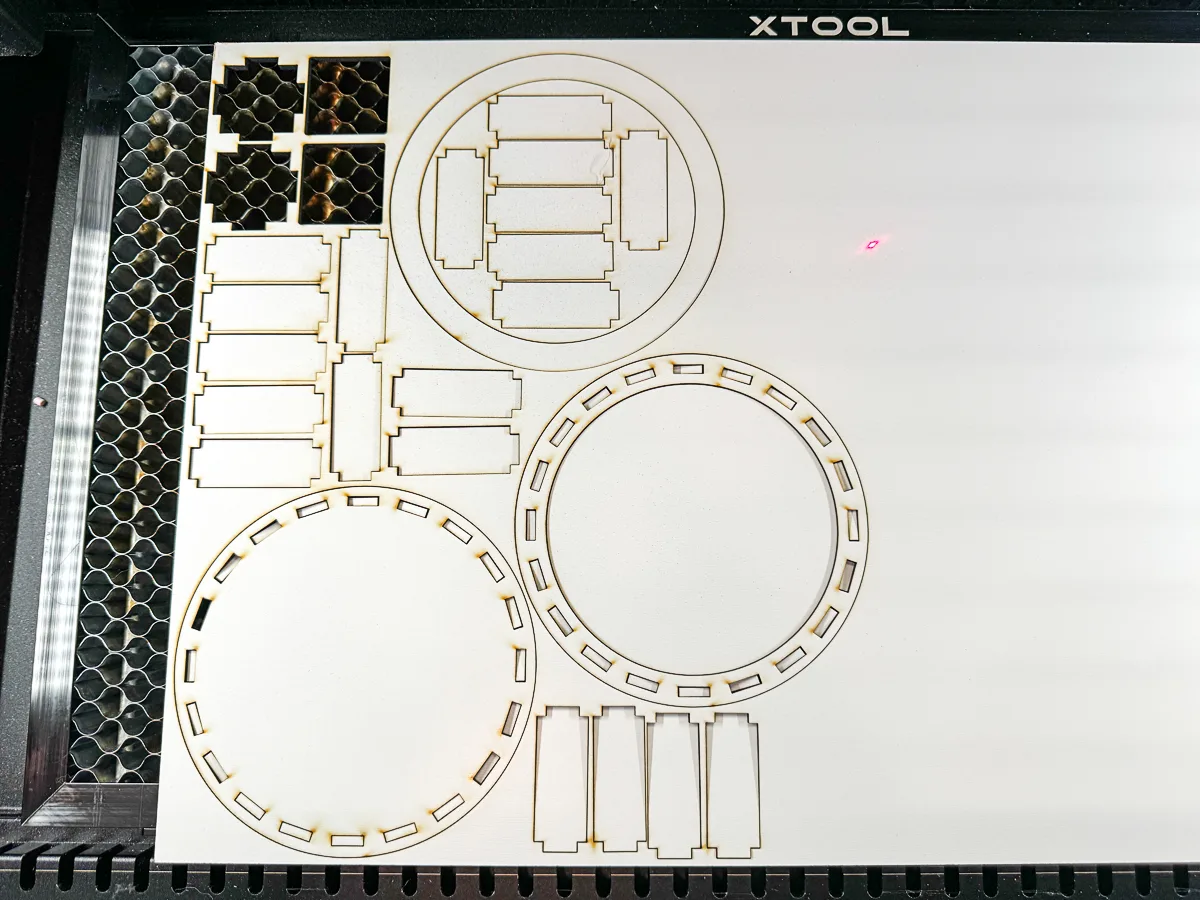 pieces of the round wooden box cut out on the xTool P2 laser