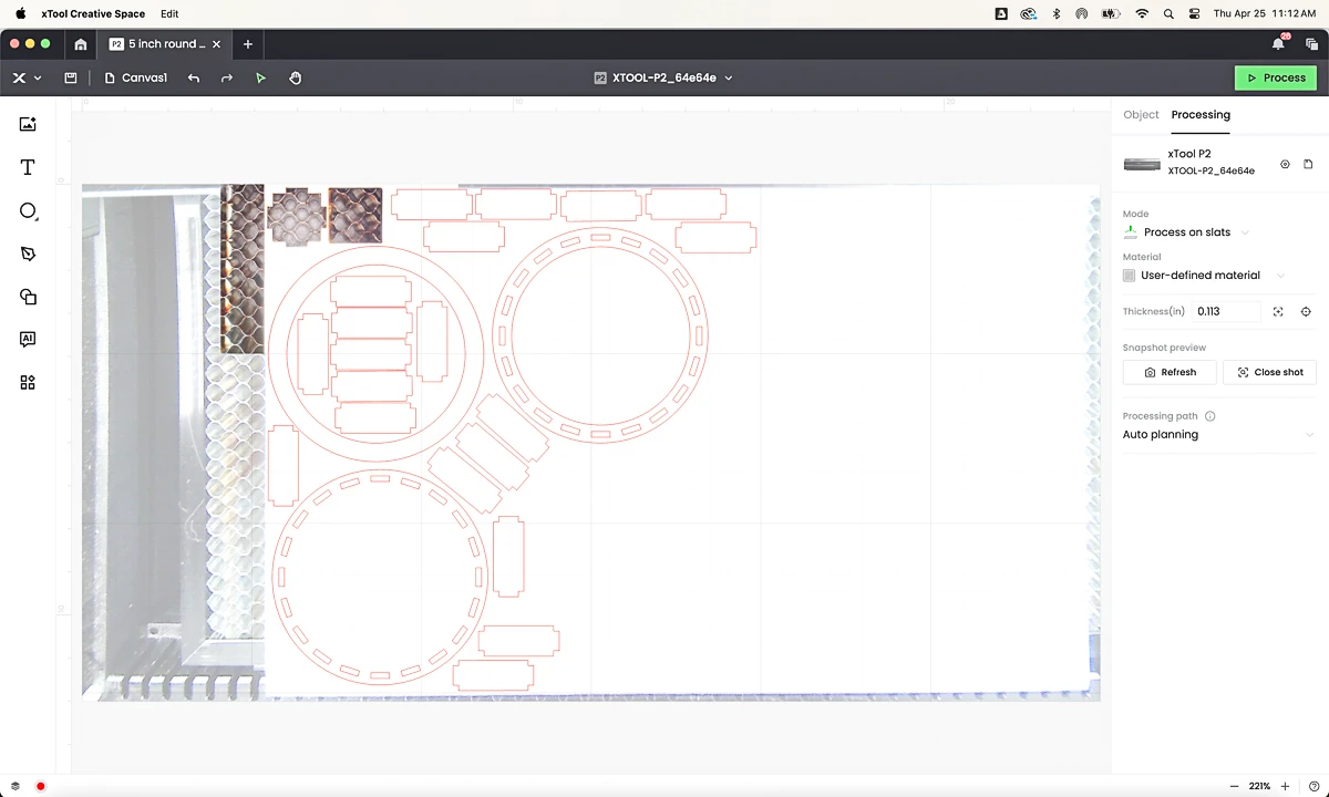 screenshot of xTool Creative Space with pieces for round wood box laid out on the board