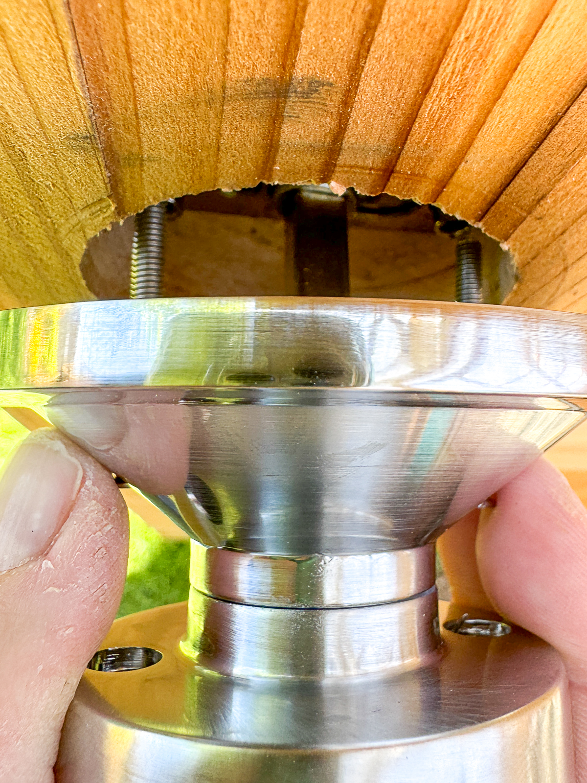 lining up the screws from the back of the door knob with the rods inside