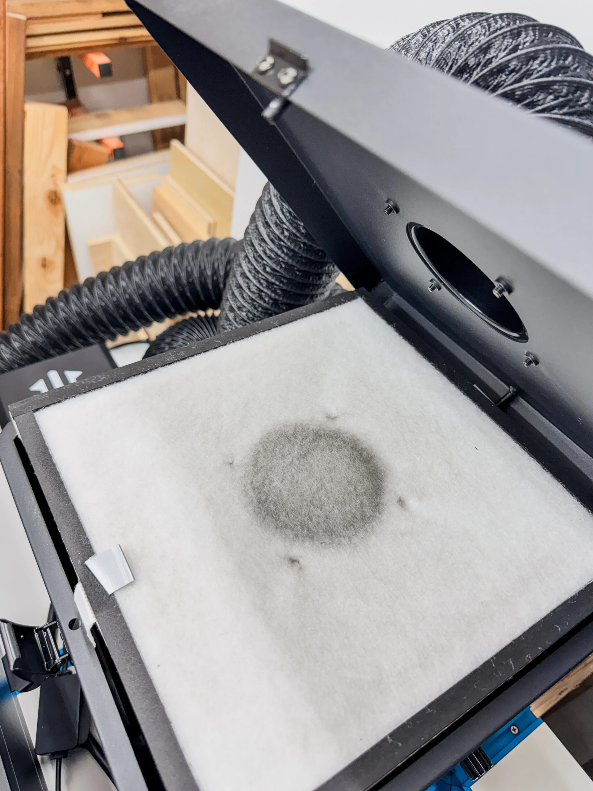 ACMER air purifier opened to reveal smoke captured in filter